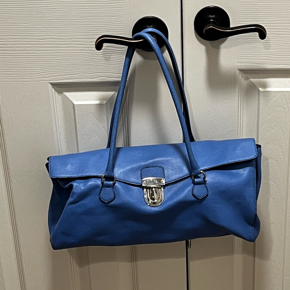 Ice blue faux leather purse with oversized press lock